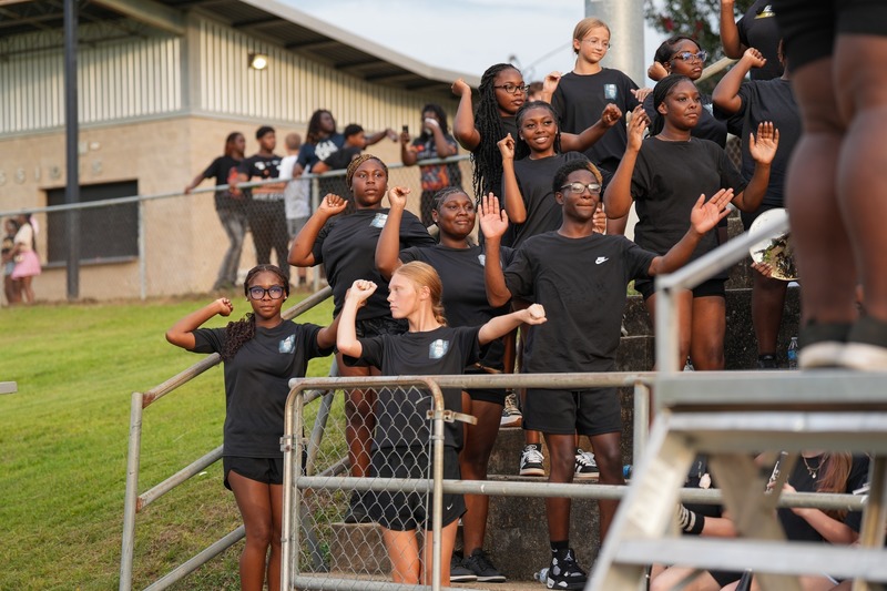 Band members dancing to a song