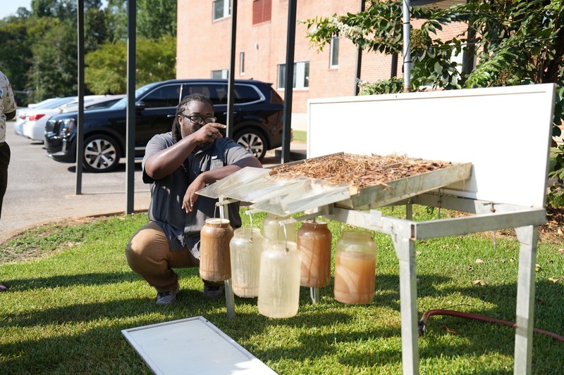 Lee Jones, USDA Soil Scientist, explains the rainfall simulator.
