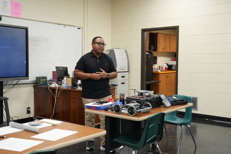 Unmanned Aircraft instructor talking to a group of people.