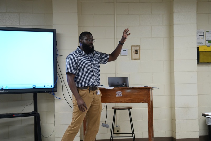 HVAC instructor is talking to a small group.