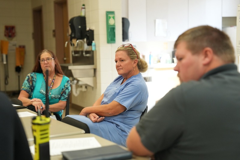 Health care professionals participate in a discussion. 0