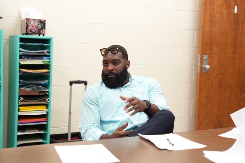 A man is talking during a discussion.