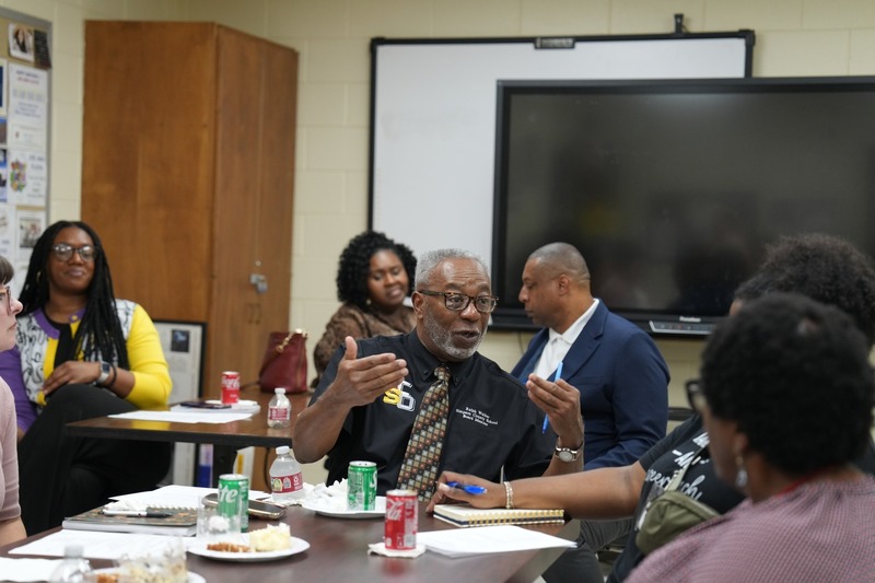 School Board President speaking during a discussion.
