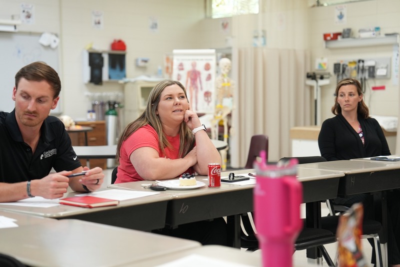 Health care professionals participate in a discussion. 0