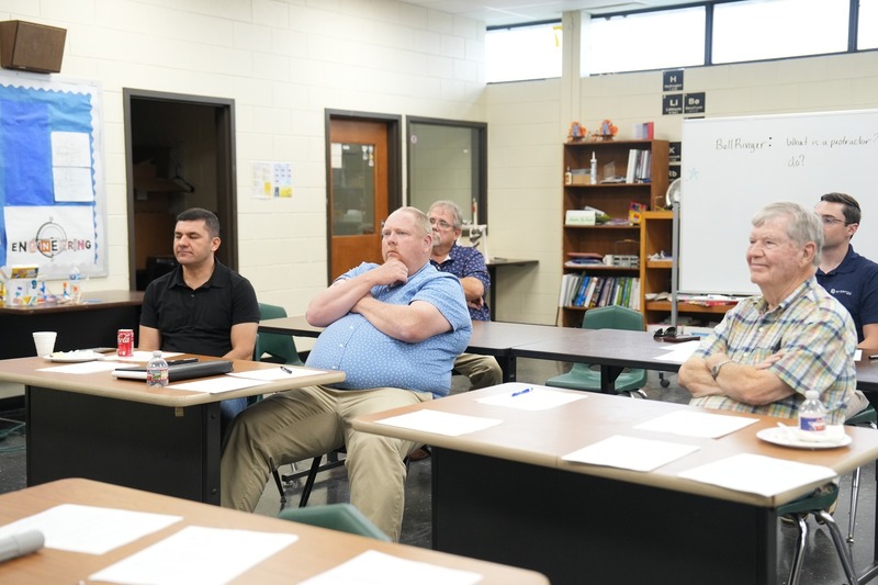 Community and industry partners listen to Unmanned Aircraft Instructor.