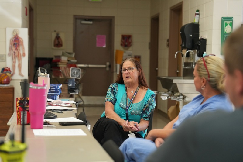 The Health Sciences Instructor is talking.