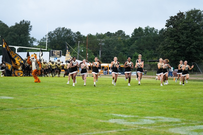 Cheerleaders running