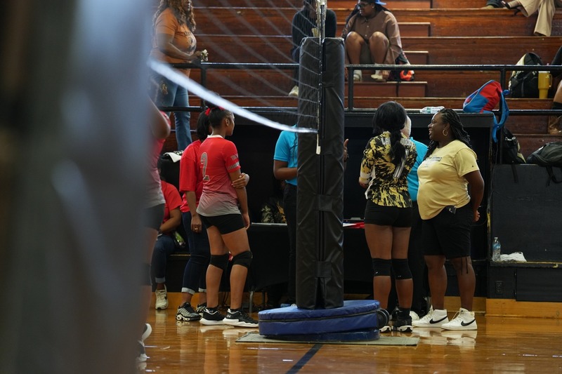 Coaches, captains, and referees meet before the game.