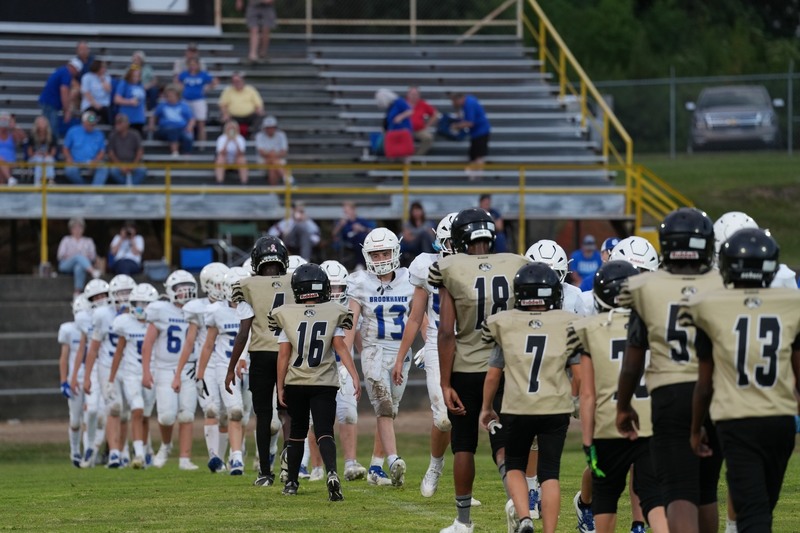 Football teams shaking hands