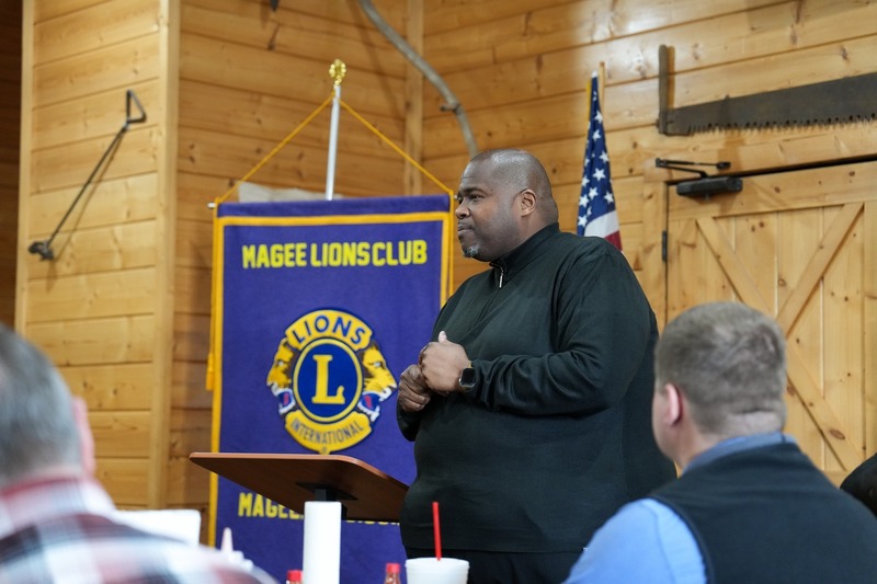 Superintendent Dr. Robert Sanders speaking a Magee Lions Club Meeting.