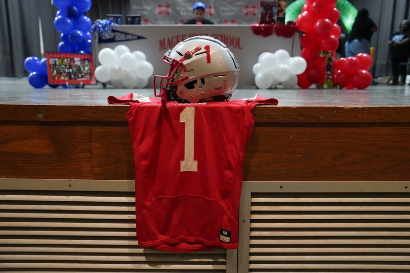 Magee Trojans helmet and jersey