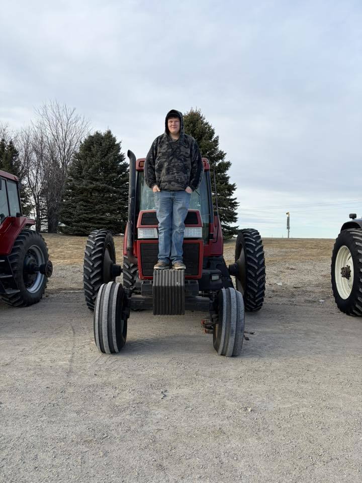 ffa students driving tractors to school