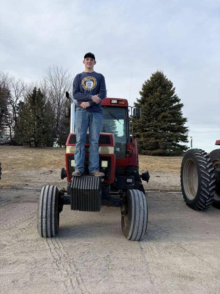 ffa students driving tractors to school
