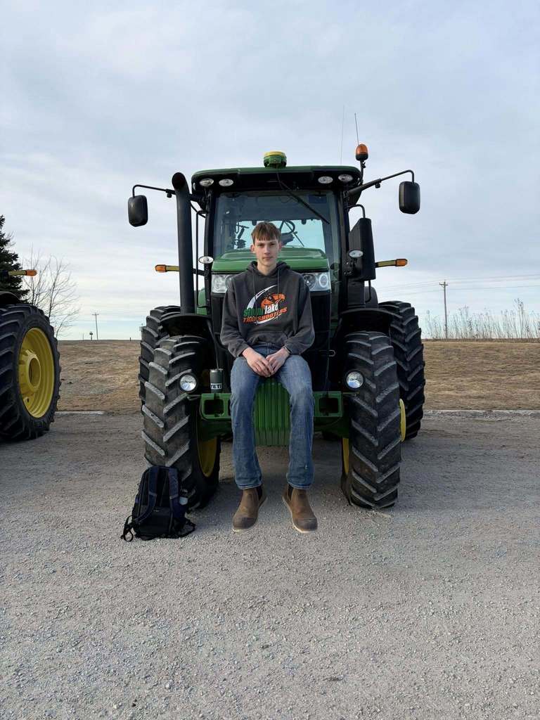 ffa students driving tractors to school