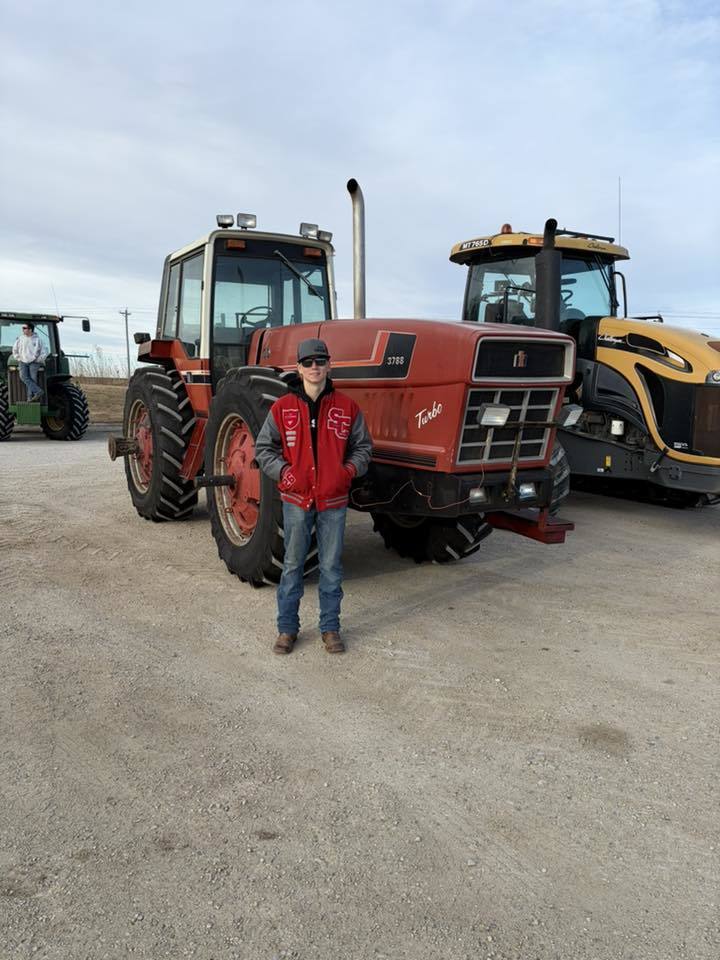 ffa students driving tractors to school