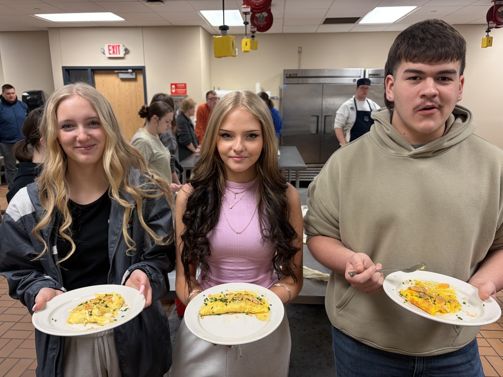 students showcasing their 3 egg omelette