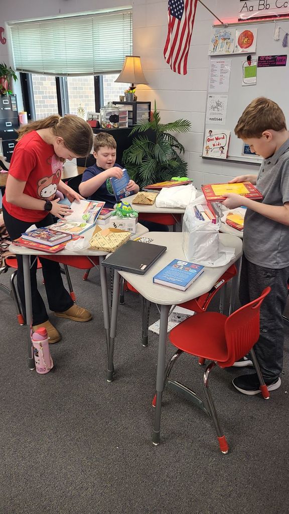 Students posing with books.