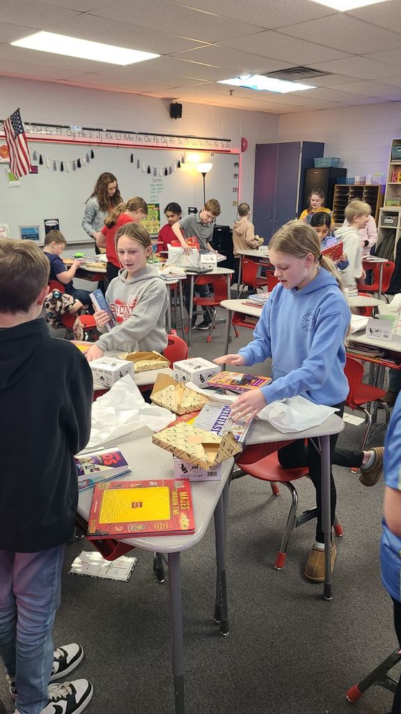 Students posing with books.