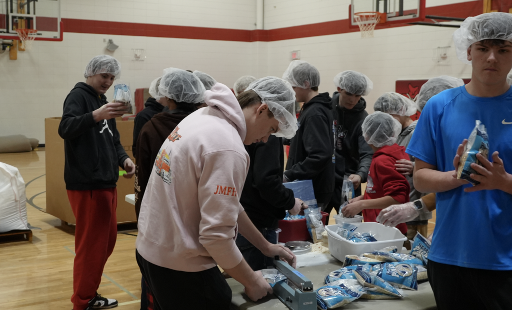 Students packing meals