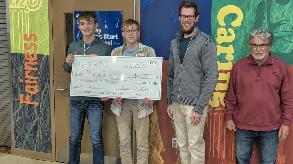 kids posing with a check (TAG)