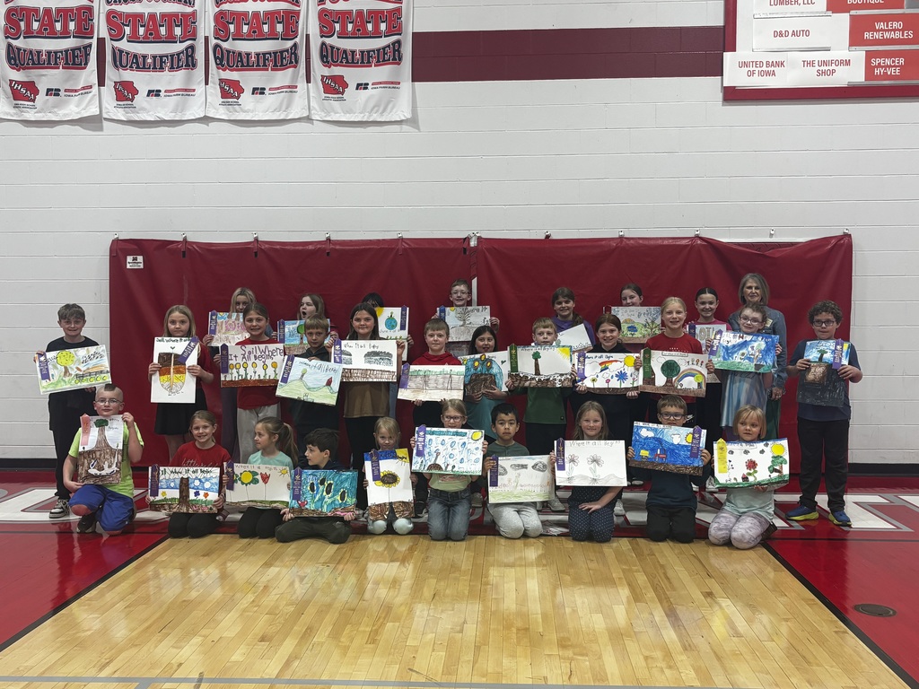 kids posing with posters