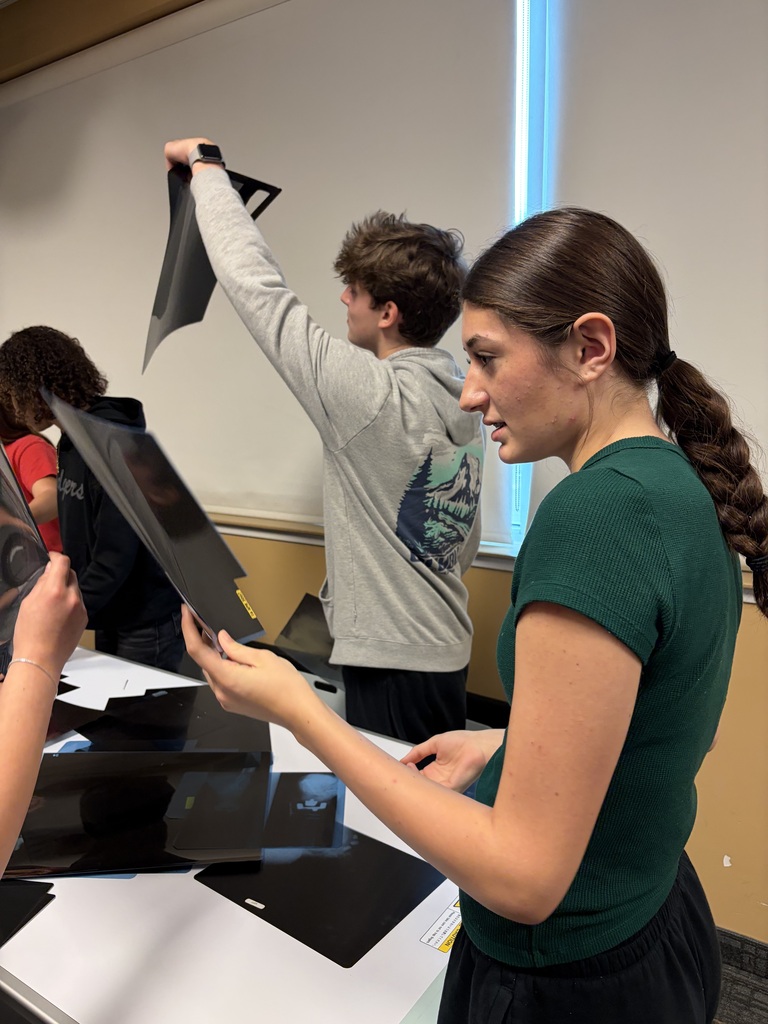 Student examining X-rays