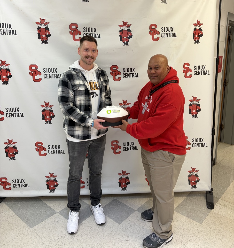 Bodi presenting the Extra Yard Award to our new recipient, Mr. Armitage.