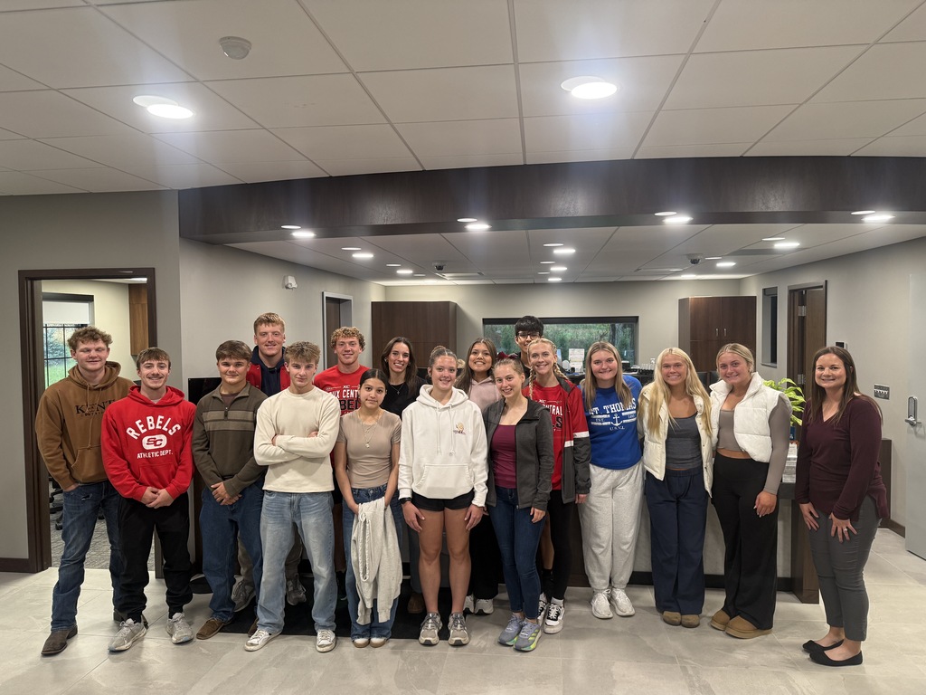 group photo of students at the local bank