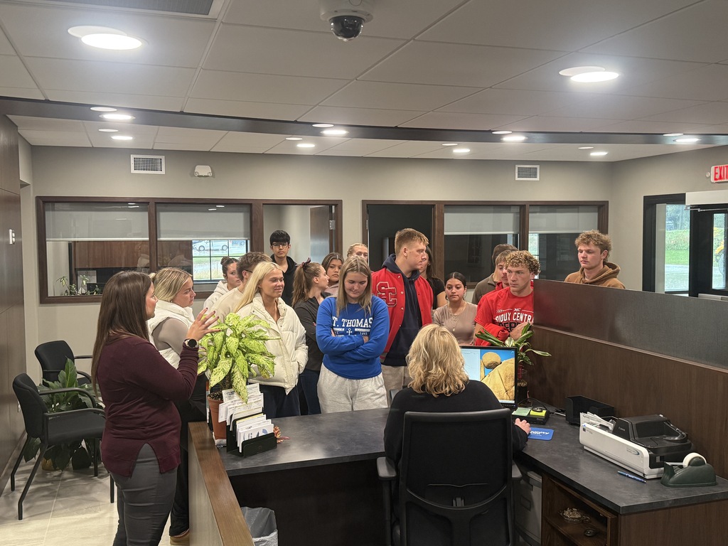 students learning at the local bank