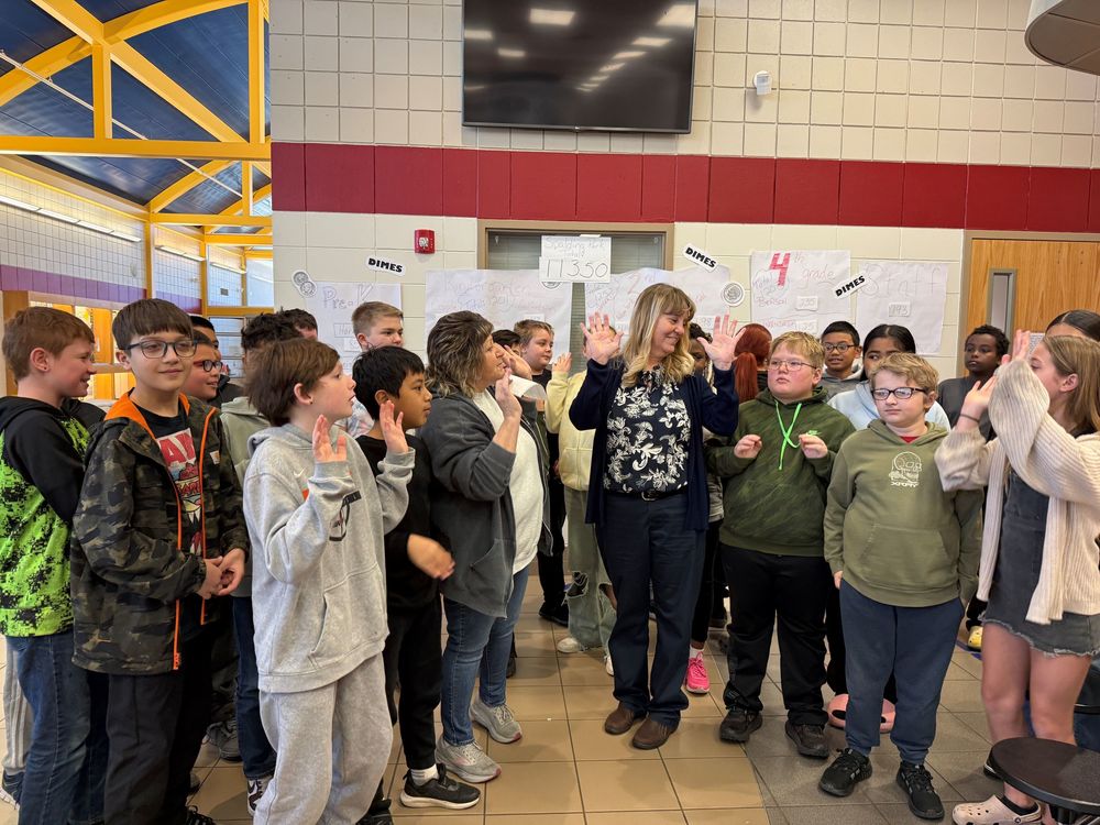 Students at Spalding Park Environmental Sciences Elementary School collected 11,028 dimes for the Siouxland Humane Society as part of their 100th day of school celebration.