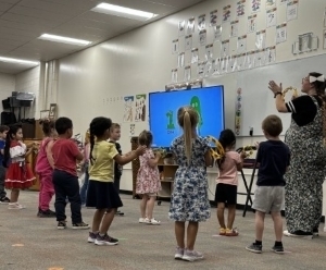 Janna Mix teaching music class with students