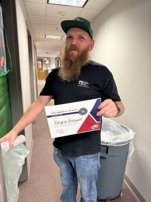 Bryce Brewer poses with certificate