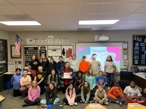 Mackenzie Schmitz poses with her certificate and class