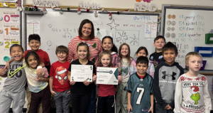 Denise Jensen poses with her class