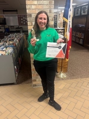 Jill Palmiotti poses with a certificate