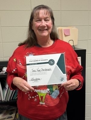 Toni Ray Christensen poses with certificate