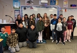 Jenny Pry Holding a Certificate