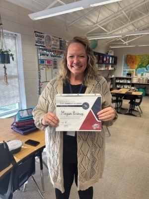 Megan Bishop holding a certificate