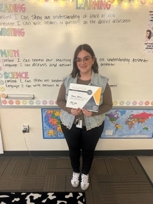Rosana DeArcos holding a certificate