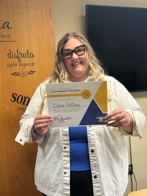 Claire McElroy poses with certificate