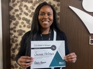 Seaniece Heilman poses with certificate