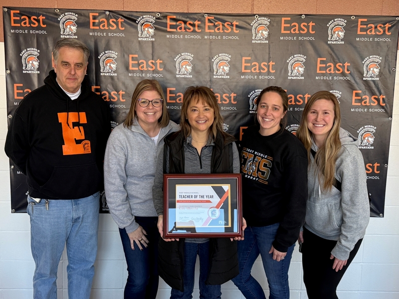 Kate Albrecht Poses with Team