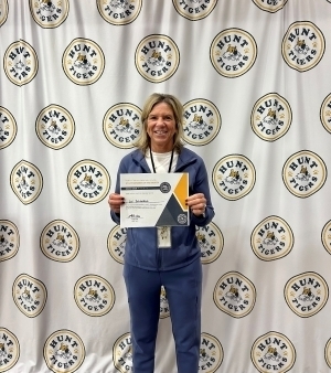 Lori Schlotfeldt poses with certificate