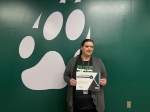 Susan Kassing poses with certificate