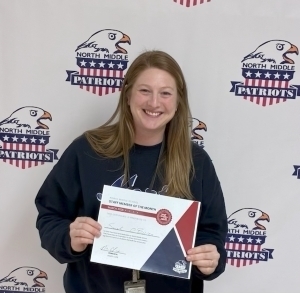 Sarah O'Brien poses with a certificate