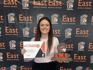 Emily Fahrendholz poses with a certificate