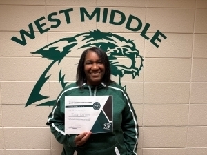 TaRae Gardner poses with a certificate