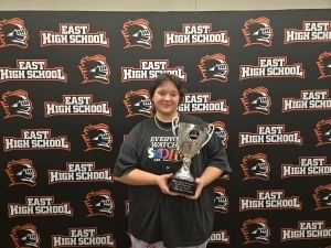 Sandra Tounjian poses with a trophy