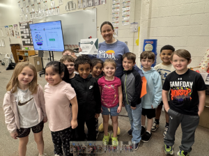 Ann Baker poses with class