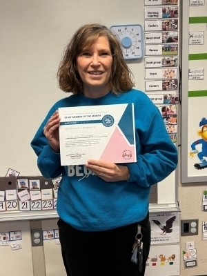 Leigh Turner poses with a certificate